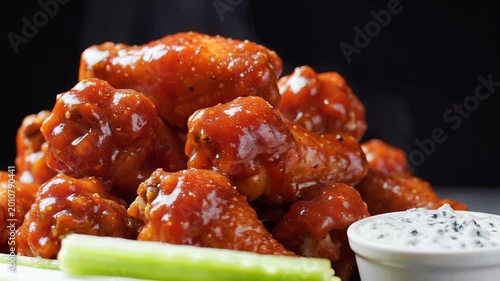 Delicious Buffalo Chicken Wings with Blue Cheese Dip and Celery Sticks.
