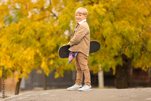 Cute little boy with skateb...