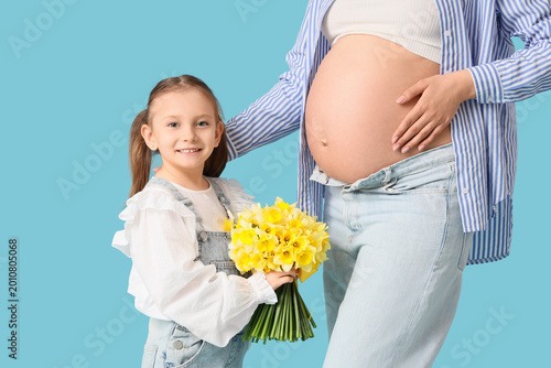 Happy pregnant woman and he...