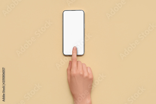 Female hand with mobile pho...