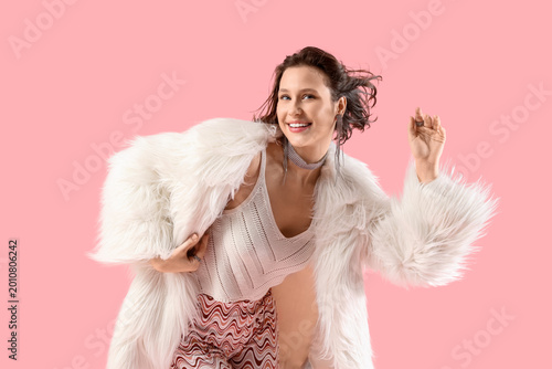 Young woman in fur coat dan...