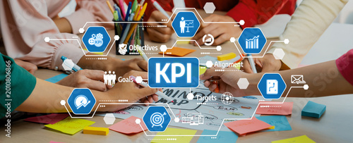 Tableau sur toile A diverse group of hands engaged in a collaborative discussion about key performance indicators
