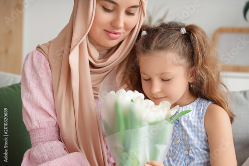 Muslim mother in hijab and ...