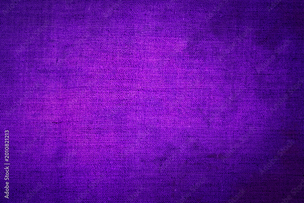 Fototapeta premium Bright purple fabric fills the space and creates a smooth surface for design projects or textile crafts in a workshop setting