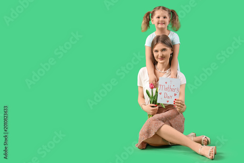 Little girl with her mom ho...