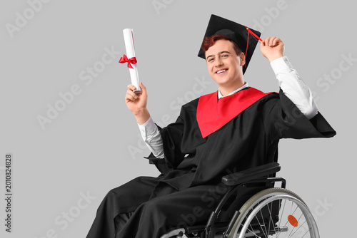 Male graduate in wheelchair...