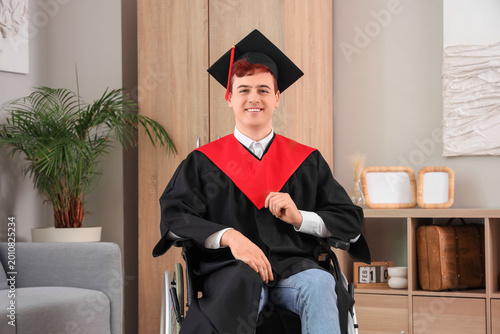Male graduate in wheelchair...