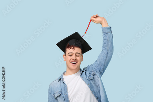 Happy male student in morta...
