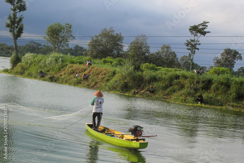 Photos Peaceful Day at a Lake with Fish Farms and a Fisherman in Indonesia