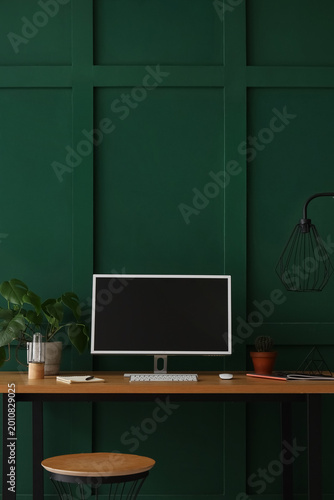Stylish workplace with mode...