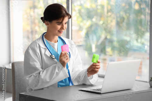Female doctor with pill box...