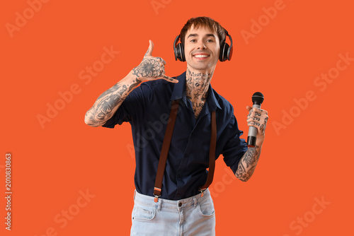 Male singer in headphones w...
