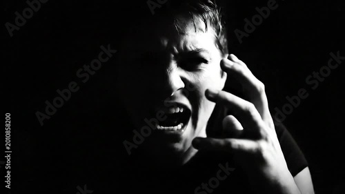 Man screaming in black and white.