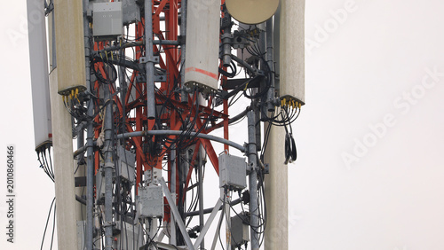 Close up of cellular tower wiring and antenna equipment with complex cable network, modern telecommunication infrastructure supporting wireless mobile communication systems