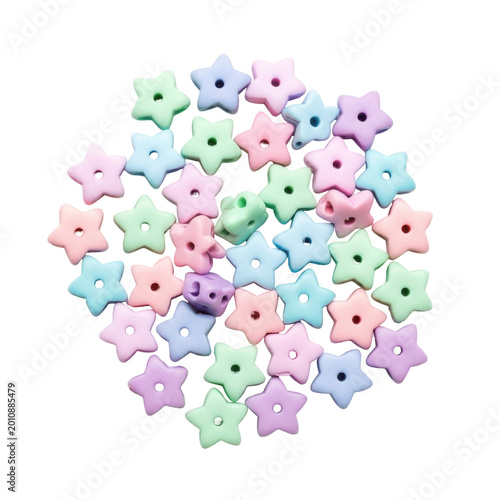 Assorted pastel colored star-shaped silicone beads isolated on white background for DIY jewelry and baby teething accessories