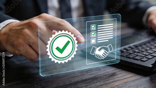 Businessman using futuristic transparent interface to approve contract digital signature and partnership deal representing innovation technology and corporate agreement in modern