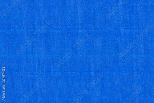 Canvastavla Blue tarpaulin texture with woven plastic pattern and glossy waterproof surface