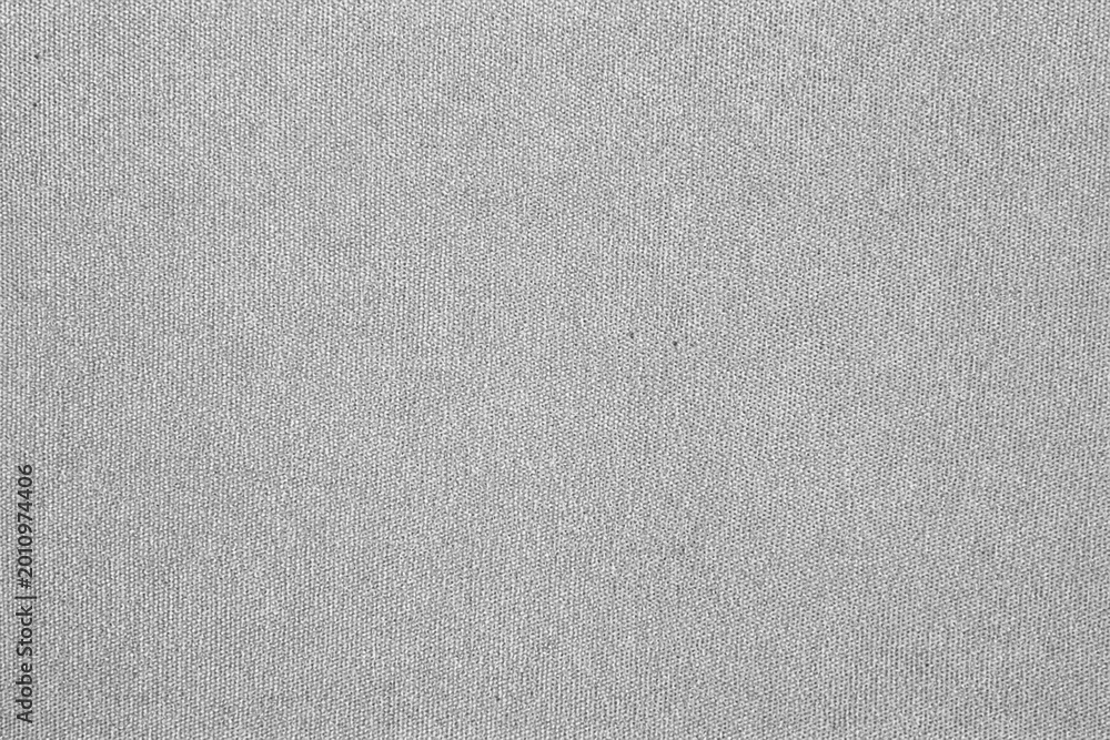 Fototapeta premium Greyscale fabric texture with soft woven surface and subtle monochrome textile details. Ideal for backgrounds, upholstery visuals, and modern minimalist design.
