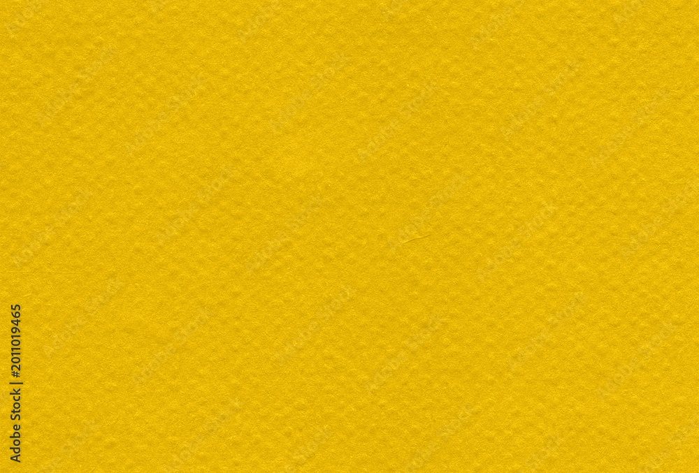 Fototapeta premium Yellow textured background with soft paper effect and uniform finish for graphic and creative projects.
