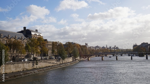 Tablou pe pânză Scenic View of the Seine River in Paris with Pont des Arts and Louvre Museum