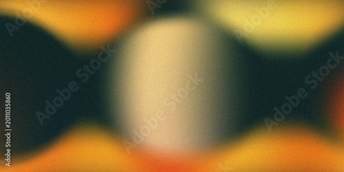 Abstract background featuring soft, out-of-focus gradients of warm orange, yellow, and deep dark tones with a grainy, textured aesthetic.