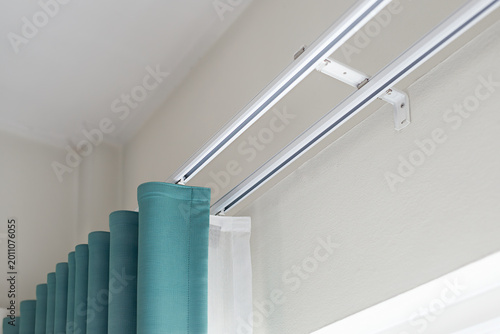 Wall-mounted double curtain track system with brackets