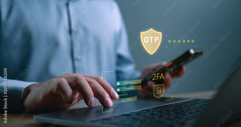 Fototapeta premium Business user accessing secure login system with OTP verification and two factor authentication on laptop and smartphone for online cybersecurity protection.