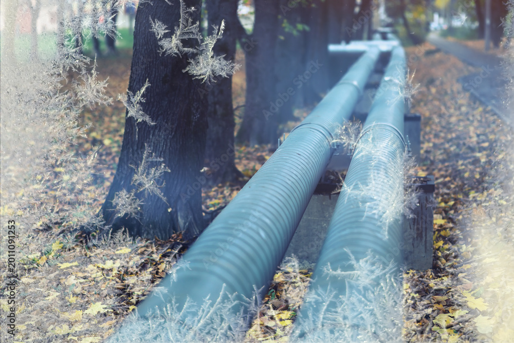 Naklejka premium Winter gas pipeline. Metal pipes on the street. pipes from the pipeline. heat-pipe.