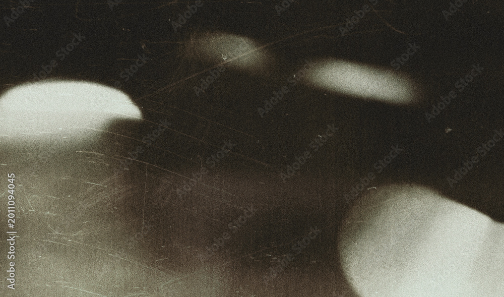 Fototapeta premium Old film texture with scratches, noise and light leaks. Realistic transparent overlay film texture in black-white, dust and grain. Distressed retro movie or photo negative effect of cinema nostalgia