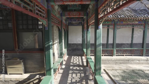 landscape view inside corridor pathway inside pavilion hall building in chinese architecture design of Summer palace heritage site in beijing in winter