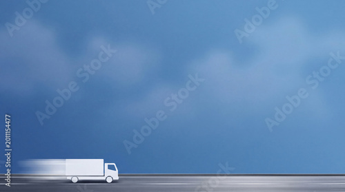 Obraz na plátne Dynamic illustration of a fast delivery truck with speed lines moving across a road under a blue sky