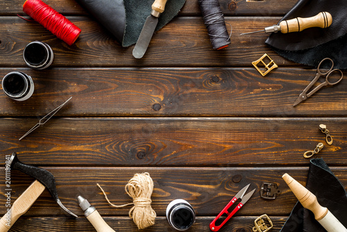 Fotografía Frame flat lay of leather craftsman or shoemaker tools and equipment, top view