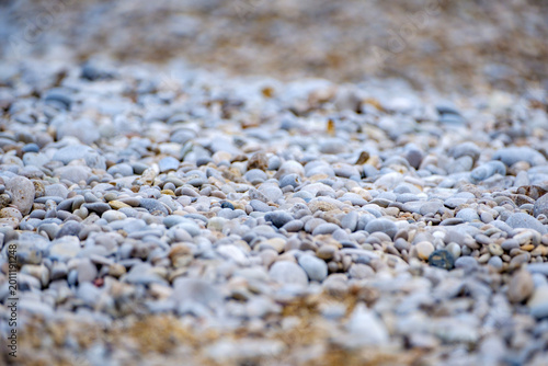 Fényképezés Ground level perspective across a vast textured plain of small grey stones