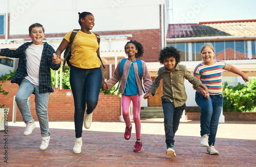Cuadro en lienzo Happy, children and holding hands at school with walk, bonding together and education for growth