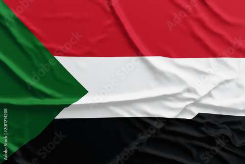 Schilderij op canvas Sudan Flag Texture – Waving Fabric Close-Up Background