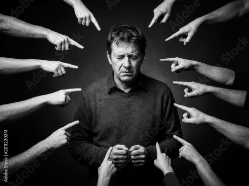 Social Judgment and Workplace Bullying Concept with Man Accused by Multiple Hands. High Contrast Monochrome Image for Mental Health Awareness, Social Pressure, and Flexible Layout.