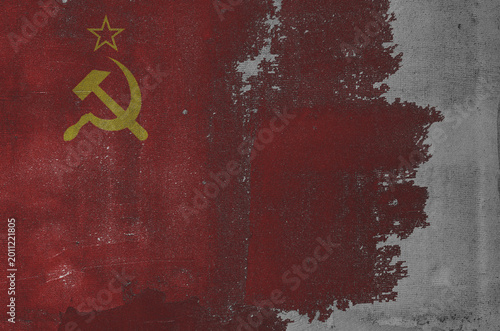 flag of the Soviet Union are painted on an old stone wall