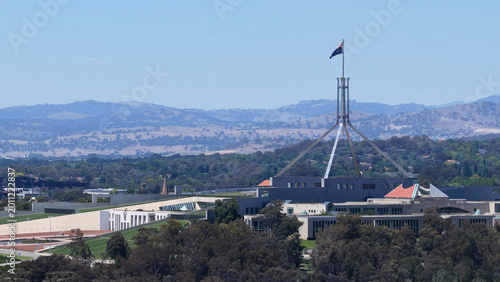 Photos Australian Parliament House and Flagpole Under Clear Blue Sky in Canberra