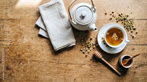 Relaxing Tea Time Still Life Cozy Wooden Table Setting for Marketing Campaigns Tea Teapot Teacup Chamomile