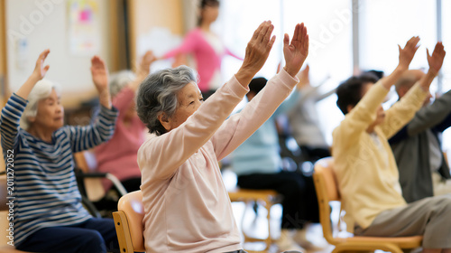 Group of Happy Senior Asian People Exercising with Raised Arms, Elderly Japanese Women in Fitness Class