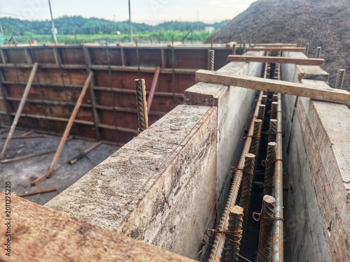 Obraz na płótnie A reinforced concrete construction site in the middle of the formwork and rebar installation phase, just prior to a concrete pour