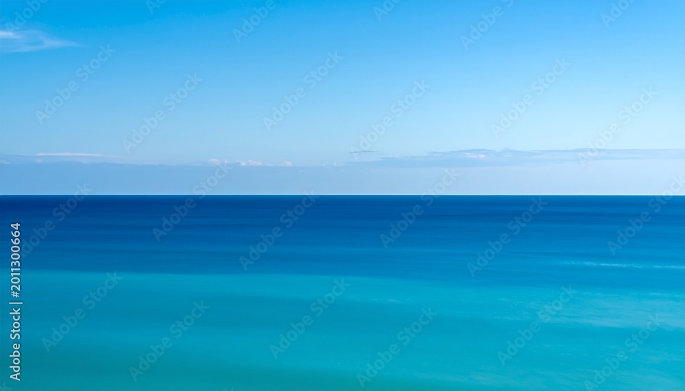 Obraz premium serene ocean horizon with soft blue gradient and minimalist sky at dusk