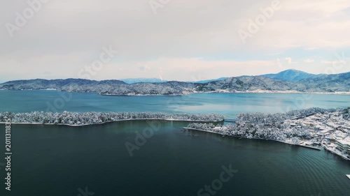 雪景色の天橋立 4Kドローン空撮 日本三景 松並木と青い海のコントラスト