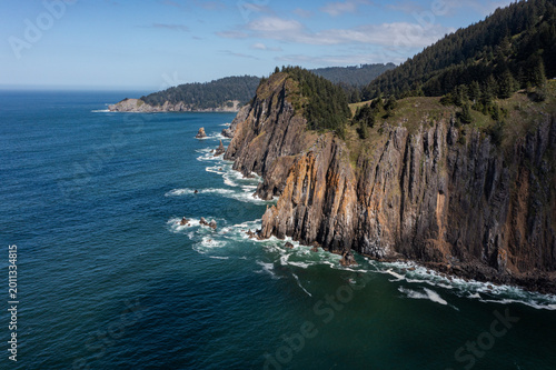Aerial drone photo of rugged cliffs and ocean waves along the Oregon Coast near Elk Flats Trail, Cape Falcon, Angora Peak, Neahkahnie Mountain, Manzanita USA. Scenic Pacific Ocean shoreline landscape