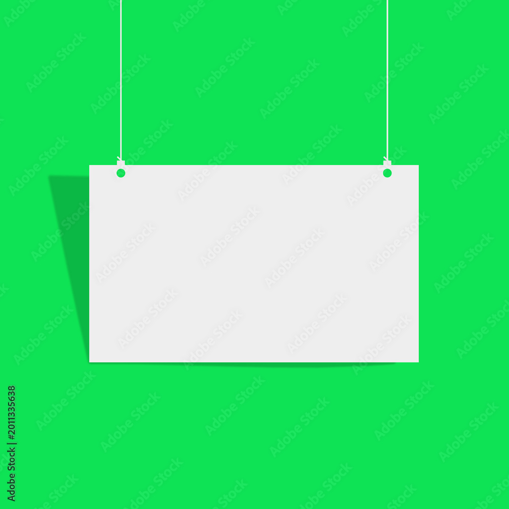 Fototapeta premium Blank white sign hanging on green background