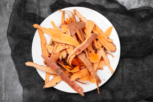 Red sweet potato peels white plate