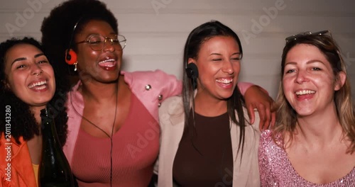 Group of multiracial girls having fun dancing together while listening music with cassette, cd player and vintage boombox stereo outdoor - Party, nightlife and people lifestyle concept 