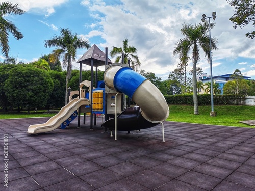 Bild auf Leinwand A modern outdoor playground structure situated on a specialized safety surface