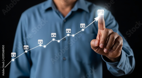 Business professional pointing at digital network icons on dark background