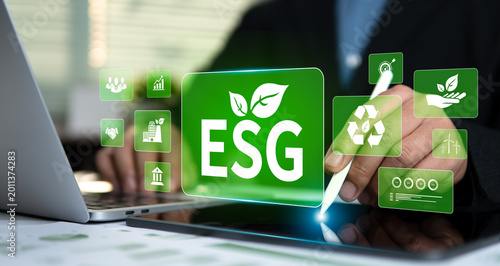 Schilderij op canvas Businessman hand using stylus pen touching ESG virtual screen for Environmental Social and Governance, Corporate sustainable development and Net Zero emissions goals 2026 concept on digital tablet